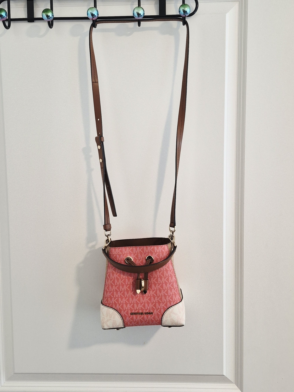 Michael Kors Mercer Gallery Small Convertible Bucket Bag in a pink grapefrue